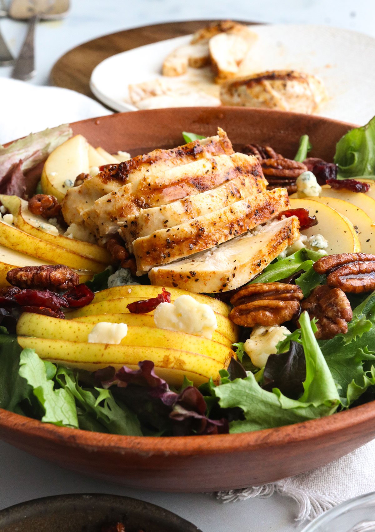 pear salad topped with grilled chicken. 