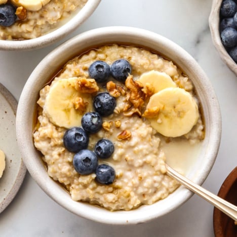 instant pot steel cut oats with berries and banana on top.