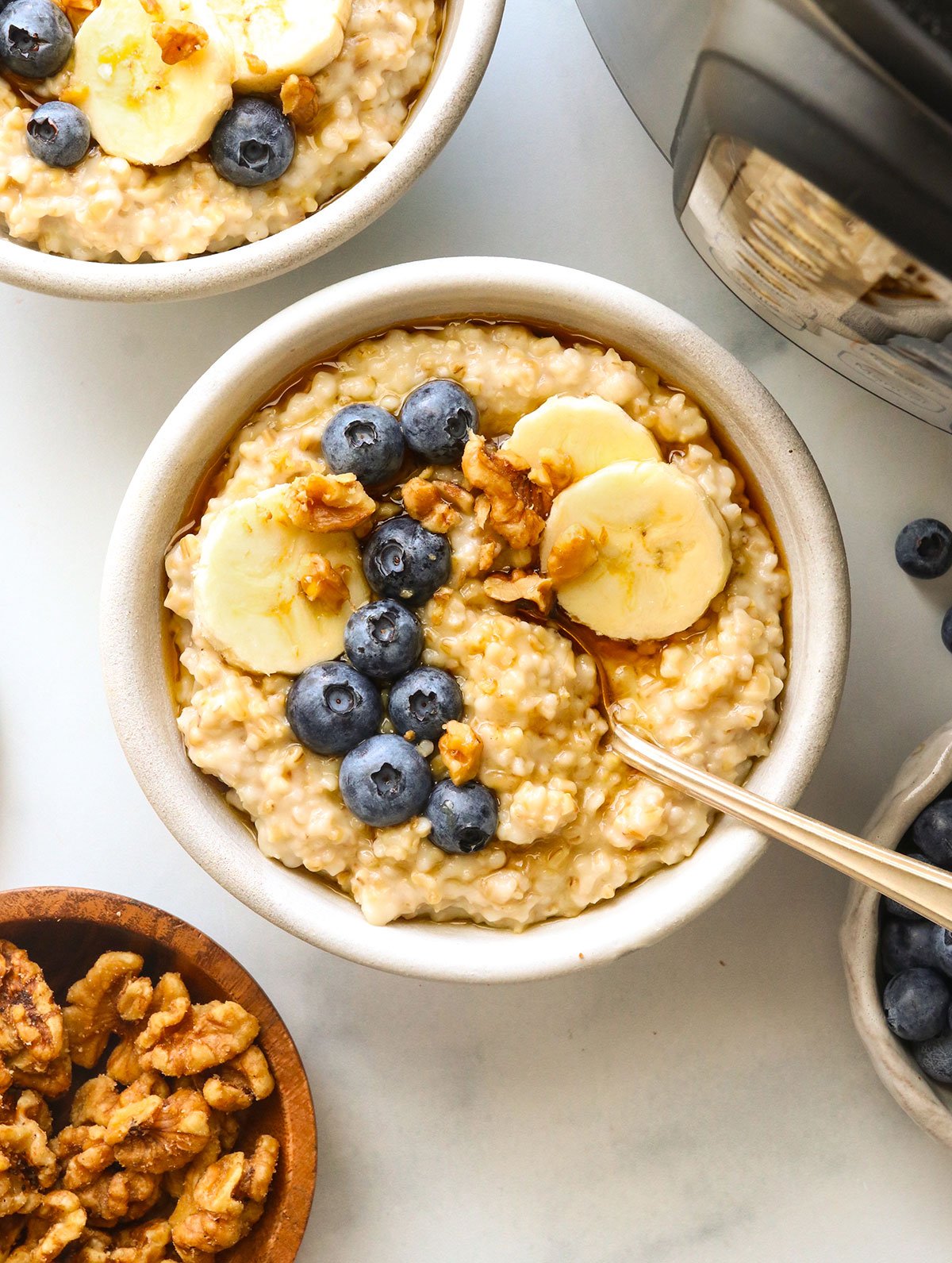 Instant pot steel cut oats served with blueberries and sliced banana.