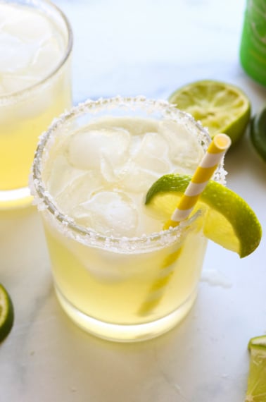 virgin margarita served with a salted rim and a lime wedge.