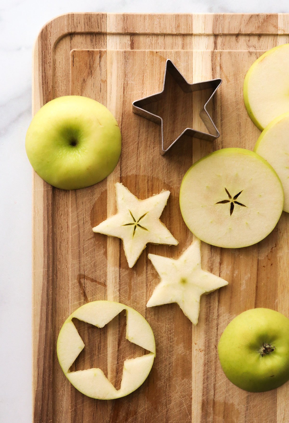star cookie cutter used to slice an apple into stars.