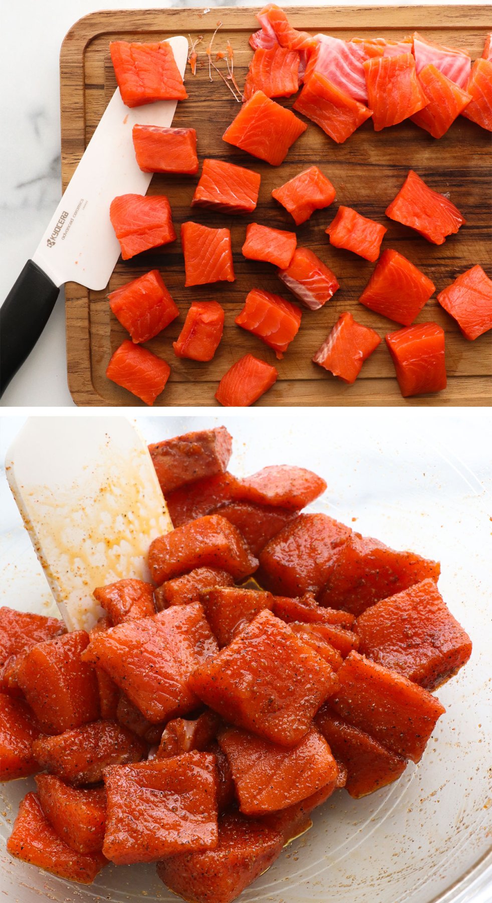 salmon sliced into chunks and seasoned in a glass bowl.