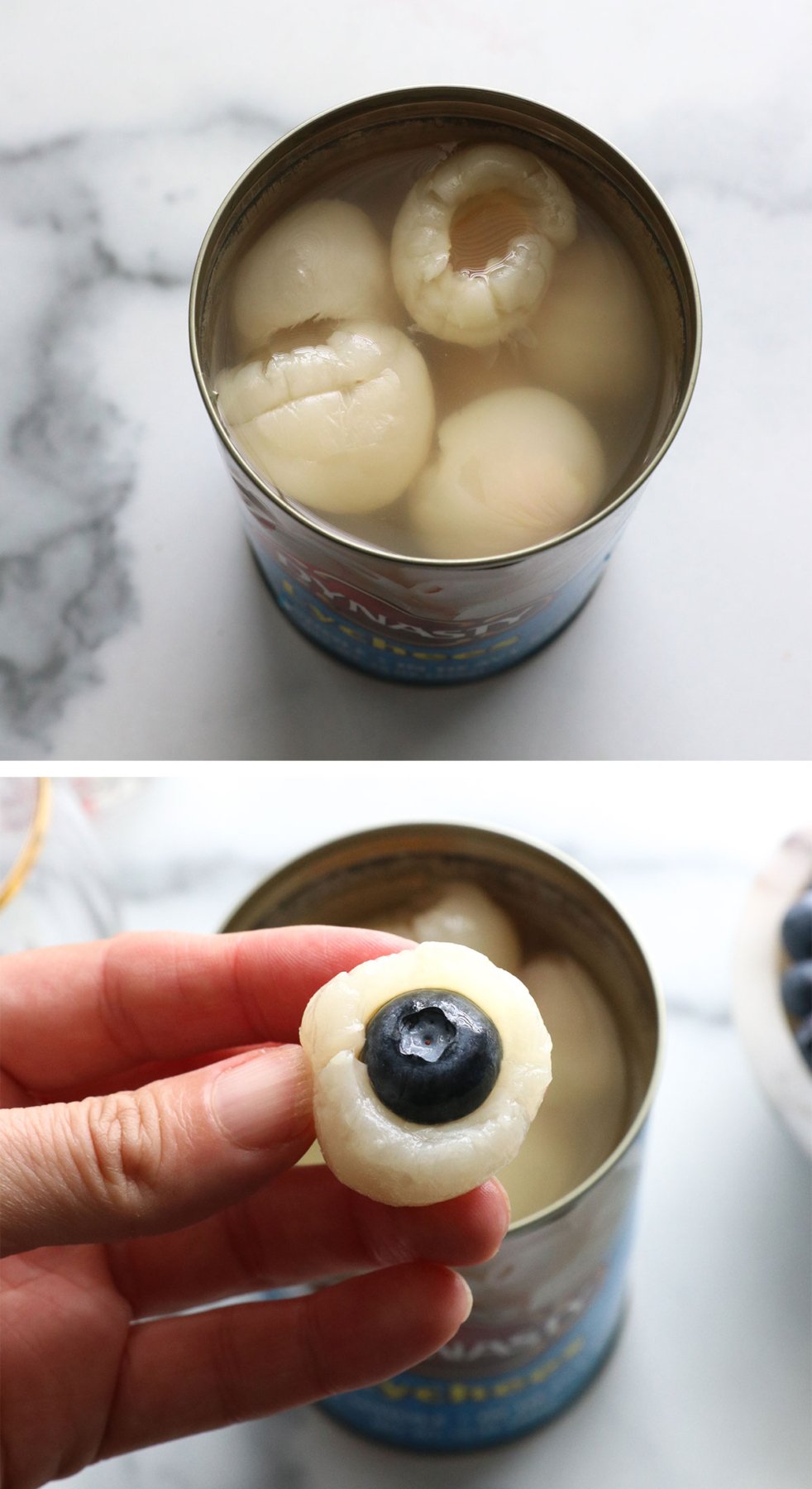 stuffing a blueberry into a canned lychee.