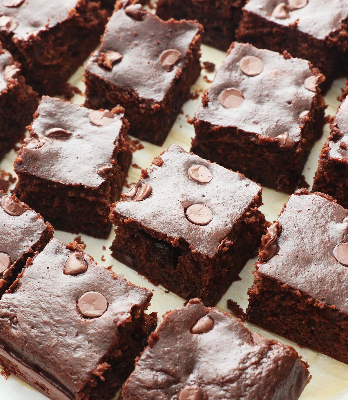 sliced sweet potato brownies with chocolate chips on top.