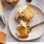 cream cheese frosting on a cranberry muffin on a plate labeled for pinterest.