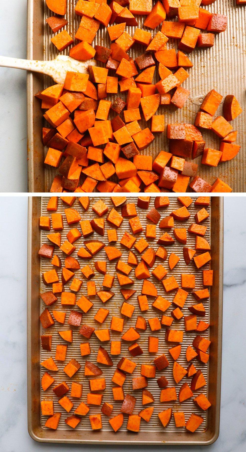 seasoned sweet potatoes spread out on a baking sheet.