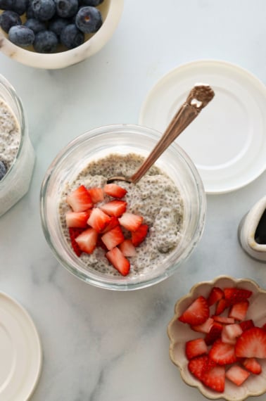 protein chia pudding topped with chopped strawberries.