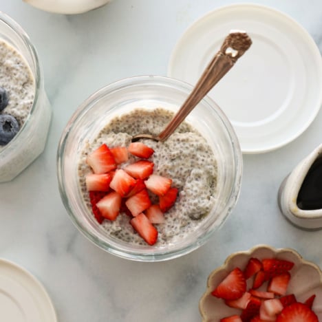 protein chia pudding topped with chopped strawberries.