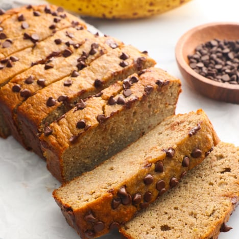 protein banana bread sliced and topped with mini chocolate chips.