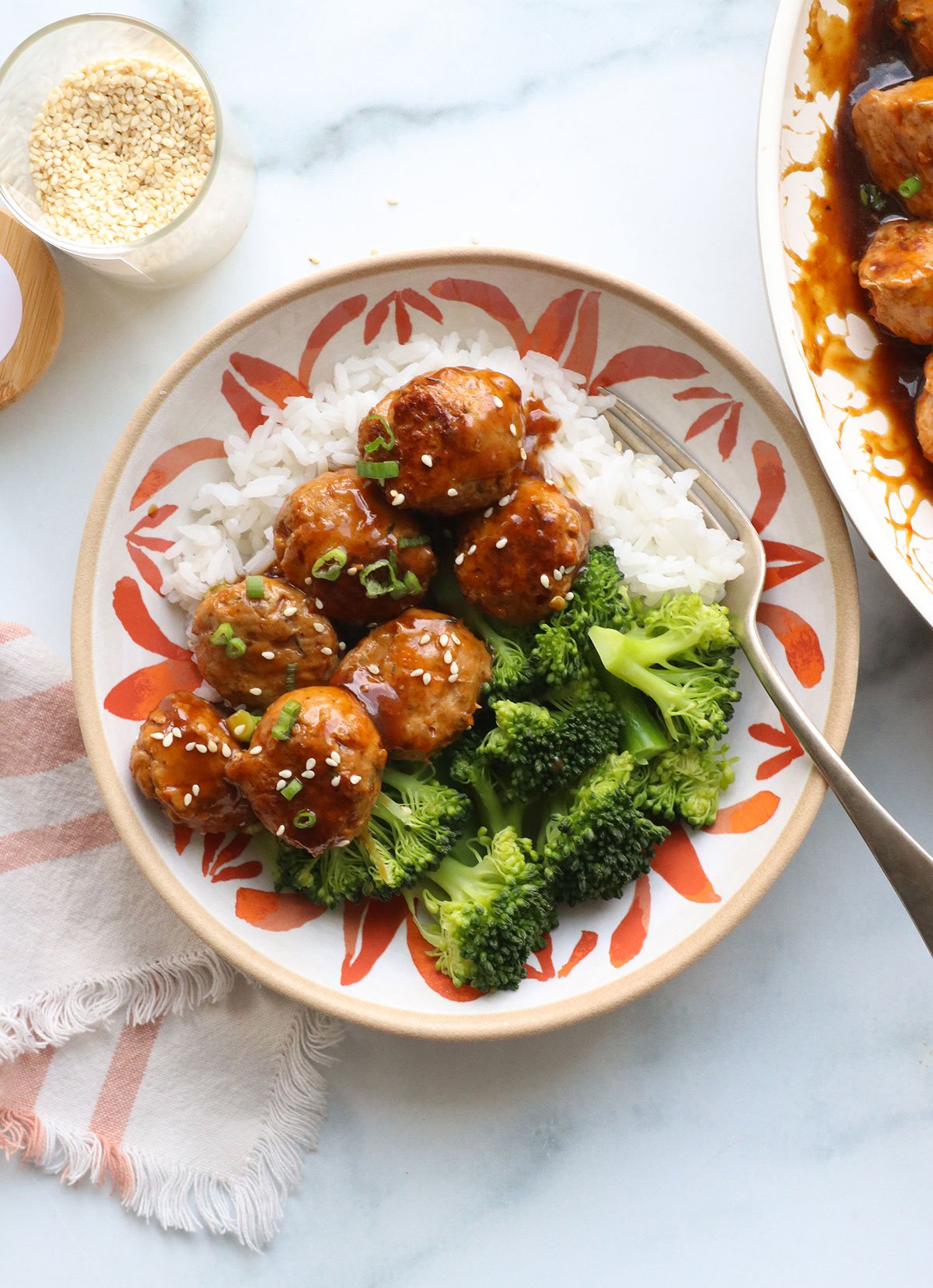 turkey meatballs in kung pao sauce with broccoli and rice.