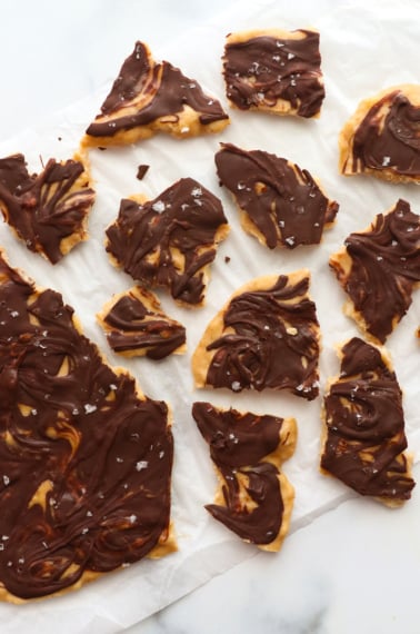 banana bark broken into pieces on parchment paper.