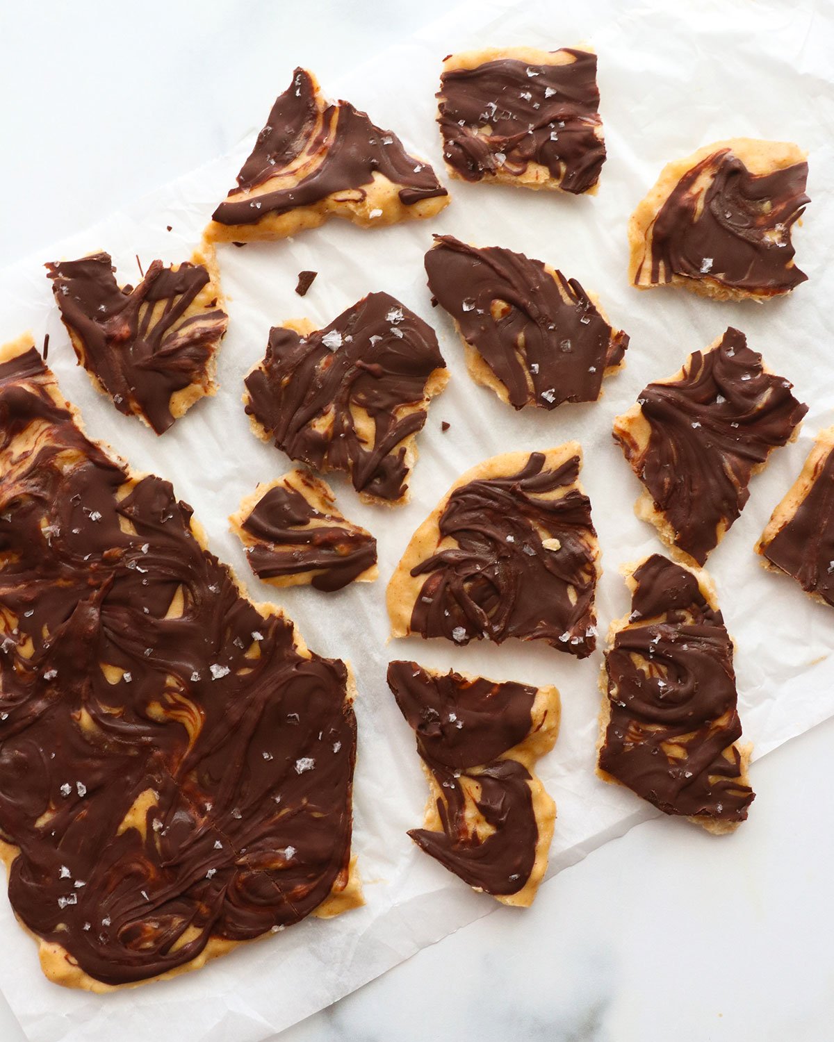 banana bark broken into pieces on parchment paper.