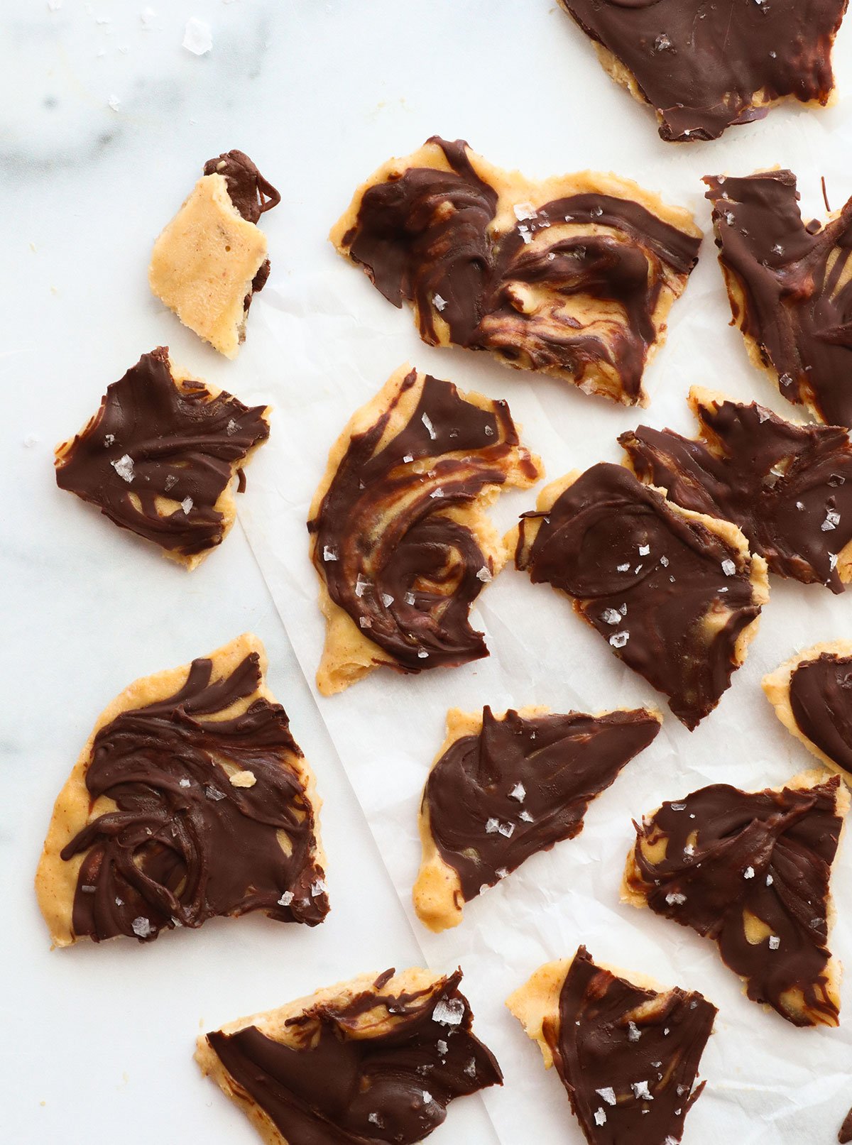 banana bark broken into chunks on parchment paper.