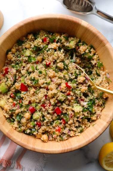 quinoa salad served in a wood bowl.