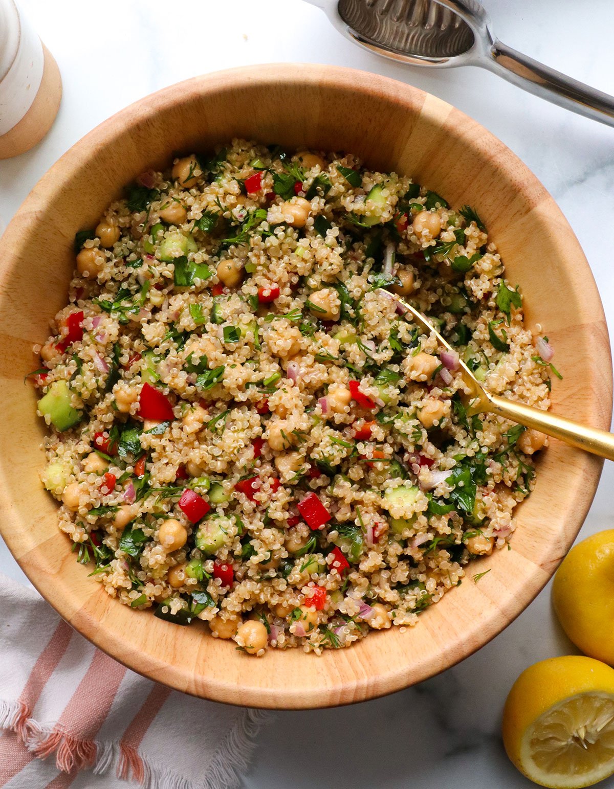 quinoa salad served in a wood bowl.