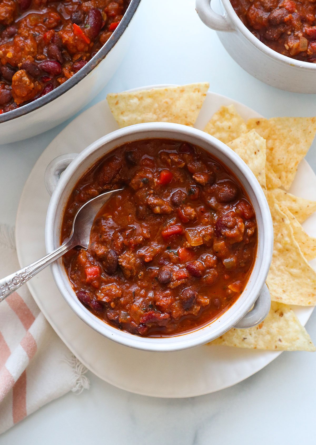 plain turkey chili served with a bowl with tortilla chips on the side. 