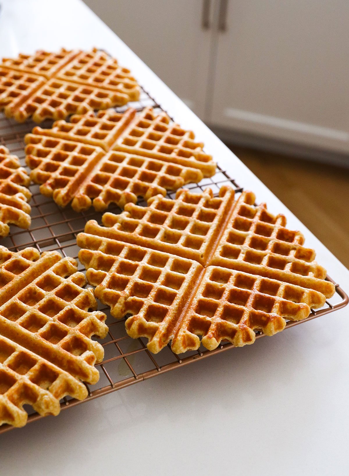 waffles cooling on a wire rack in the kitchen. 