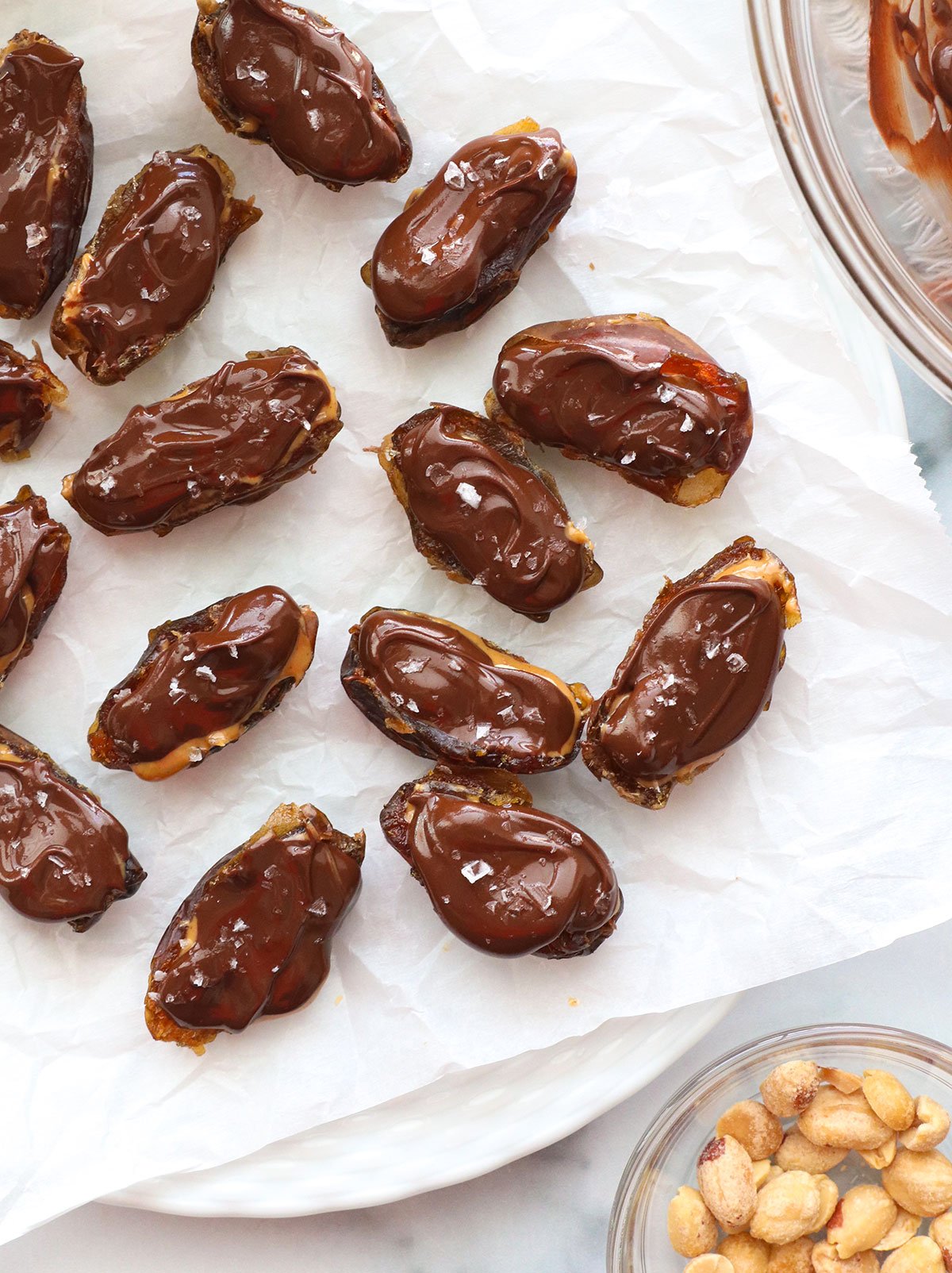 chocolate and salt added to each date on a plate.