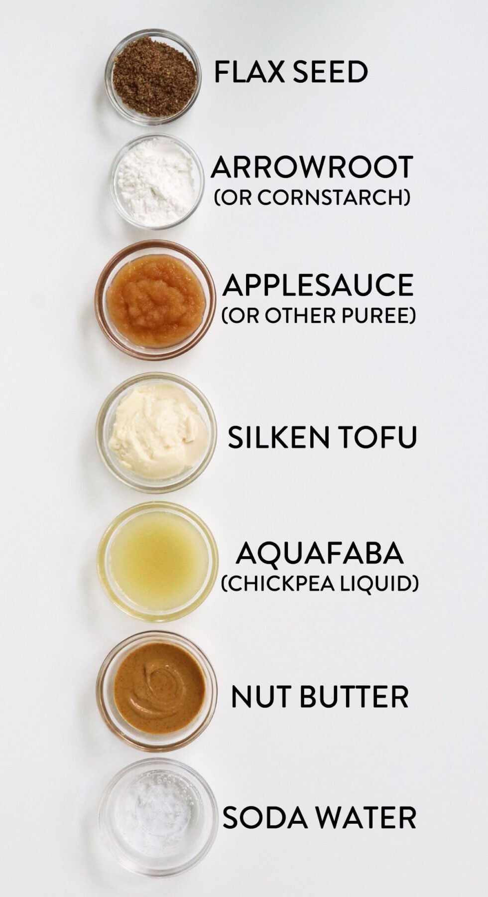 7 egg substitutes in small glass bowls labeled on white.