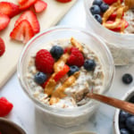 protein overnight oats topped with berries and peanut butter.