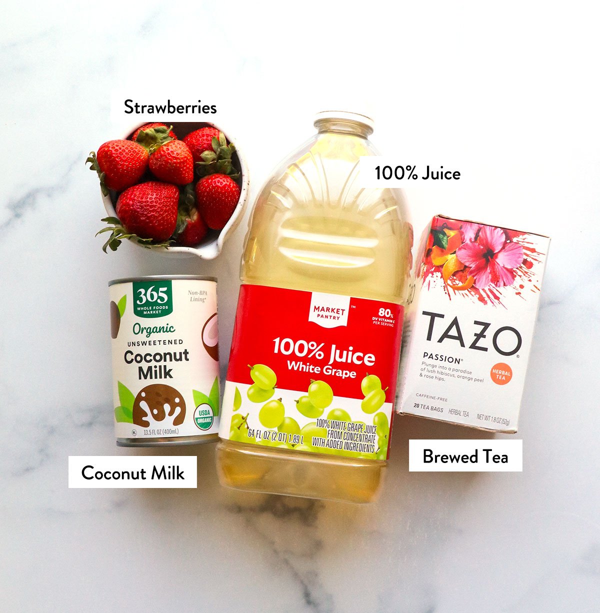 Pink beverage ingredients are labeled with white grape juice, tazo tea, coconut milk and strawberries.