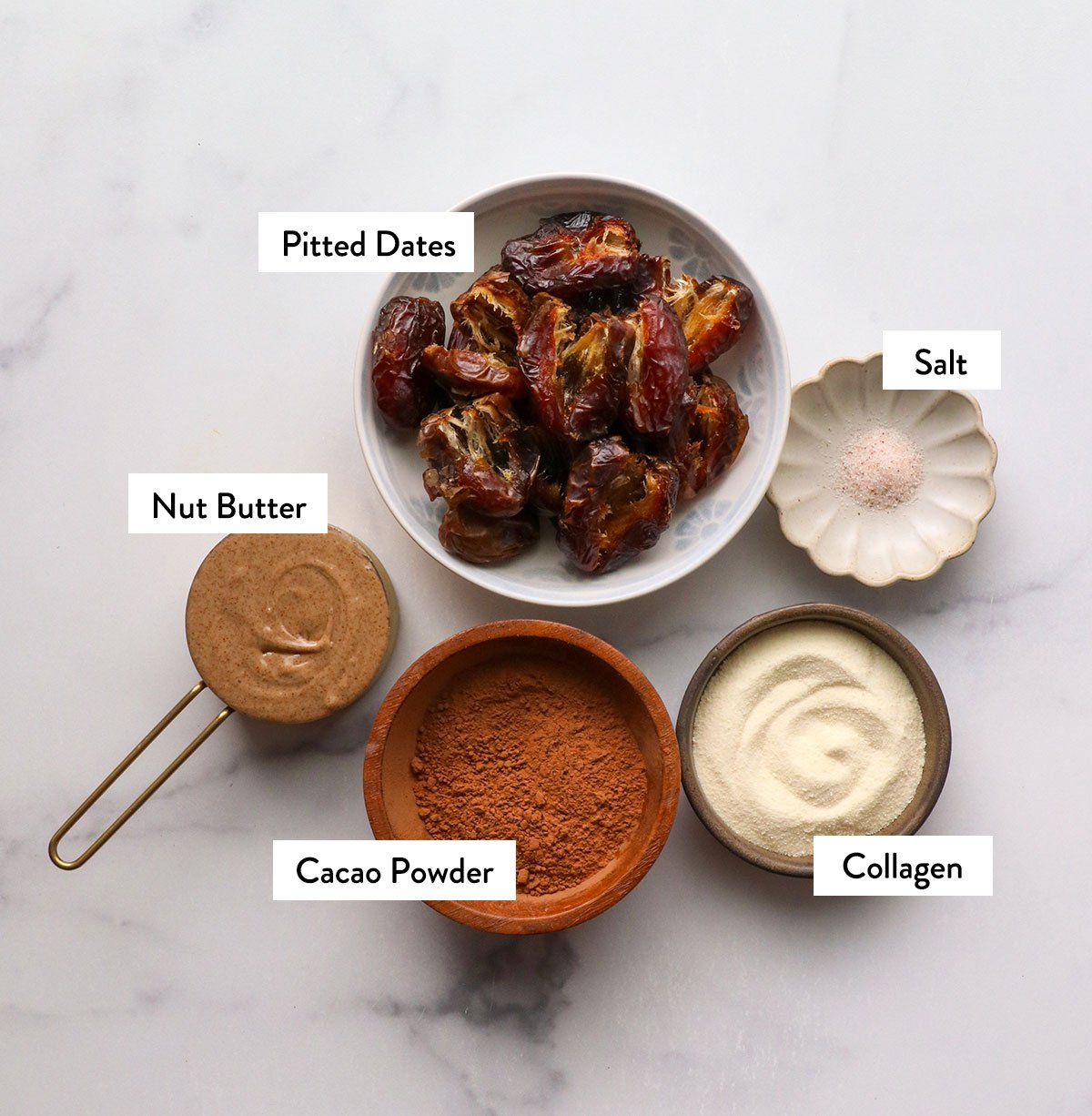 Date, nut butter, cocoa powder, collagen and salt mark in bowl.