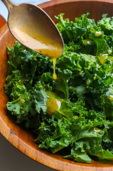 best kale dressing drizzled on a kale salad.