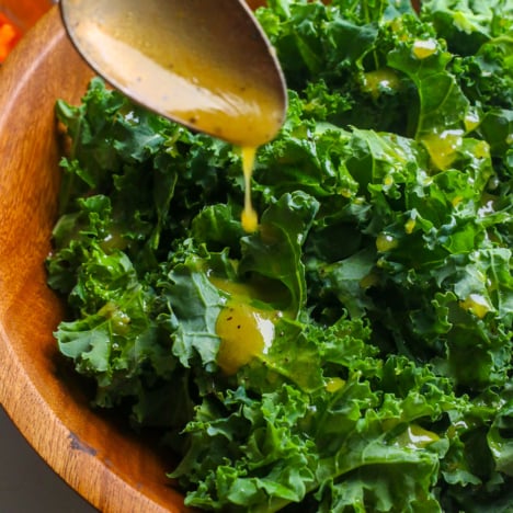 best kale dressing drizzled on a kale salad.