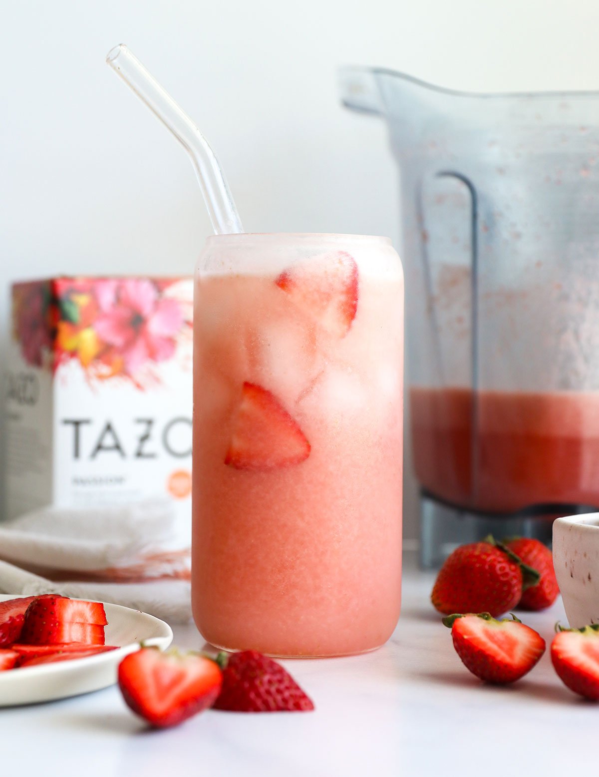 Homemade pink drink with fresh strawberries in a glass.