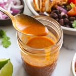 chipotle vinaigrette on a spoon over a dressing jar.