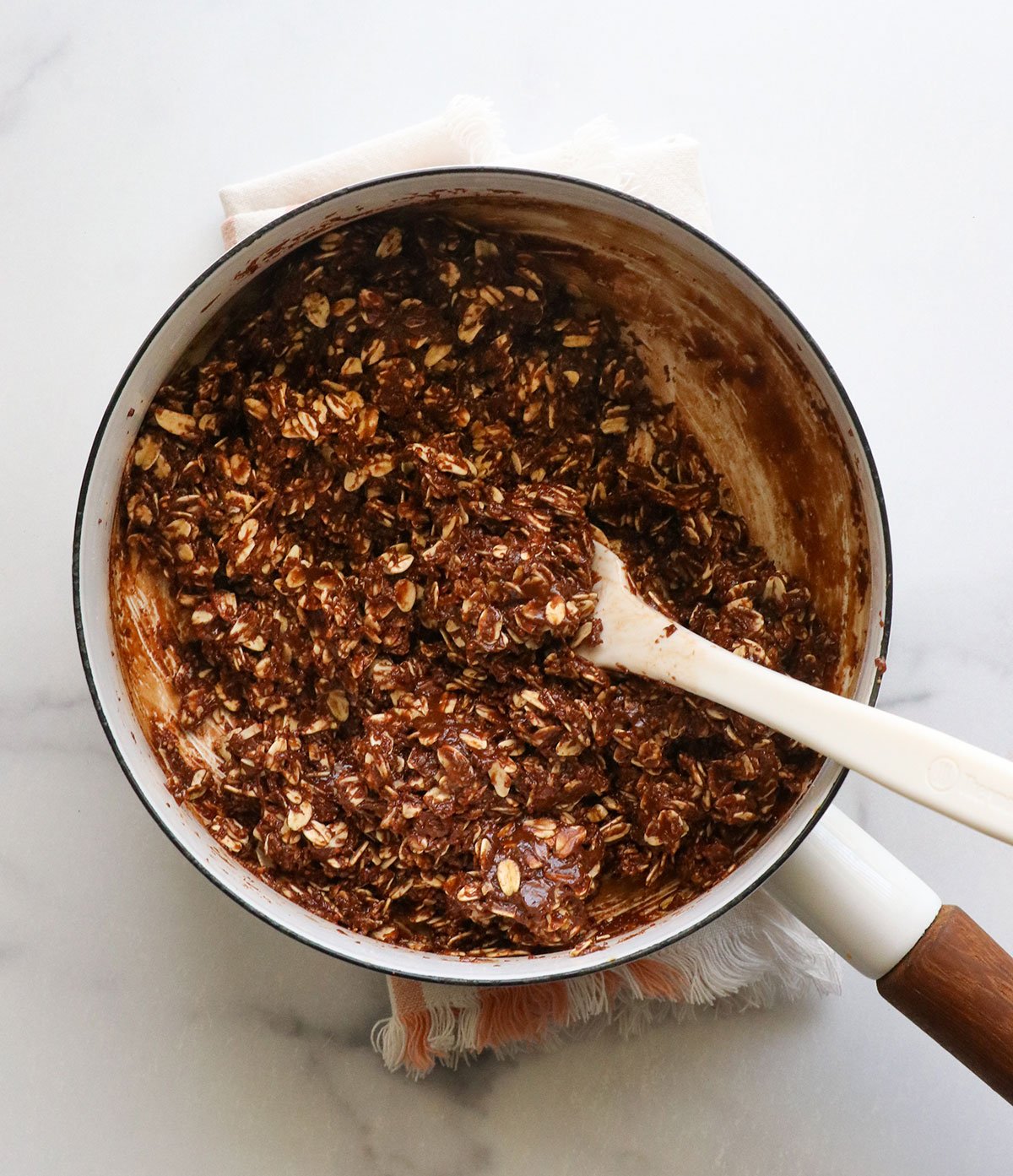 Oats are mixed into chocolate mixture.