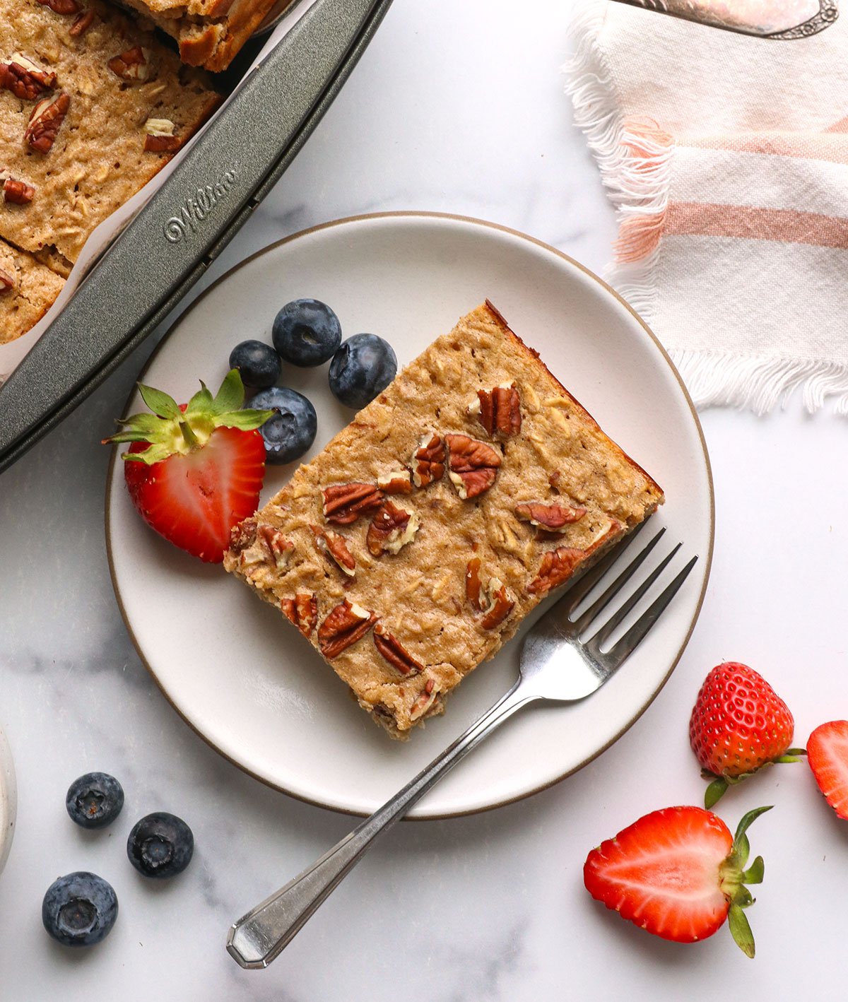 Slice protein-grilled oatmeal with berries on top.