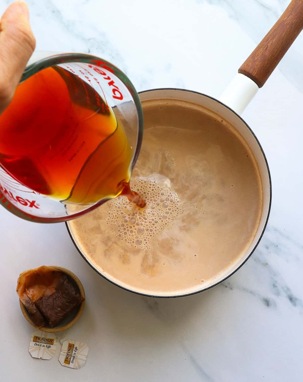 black tea poured into the saucepan.