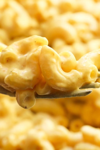 vegan mac and cheese lifted on fork.