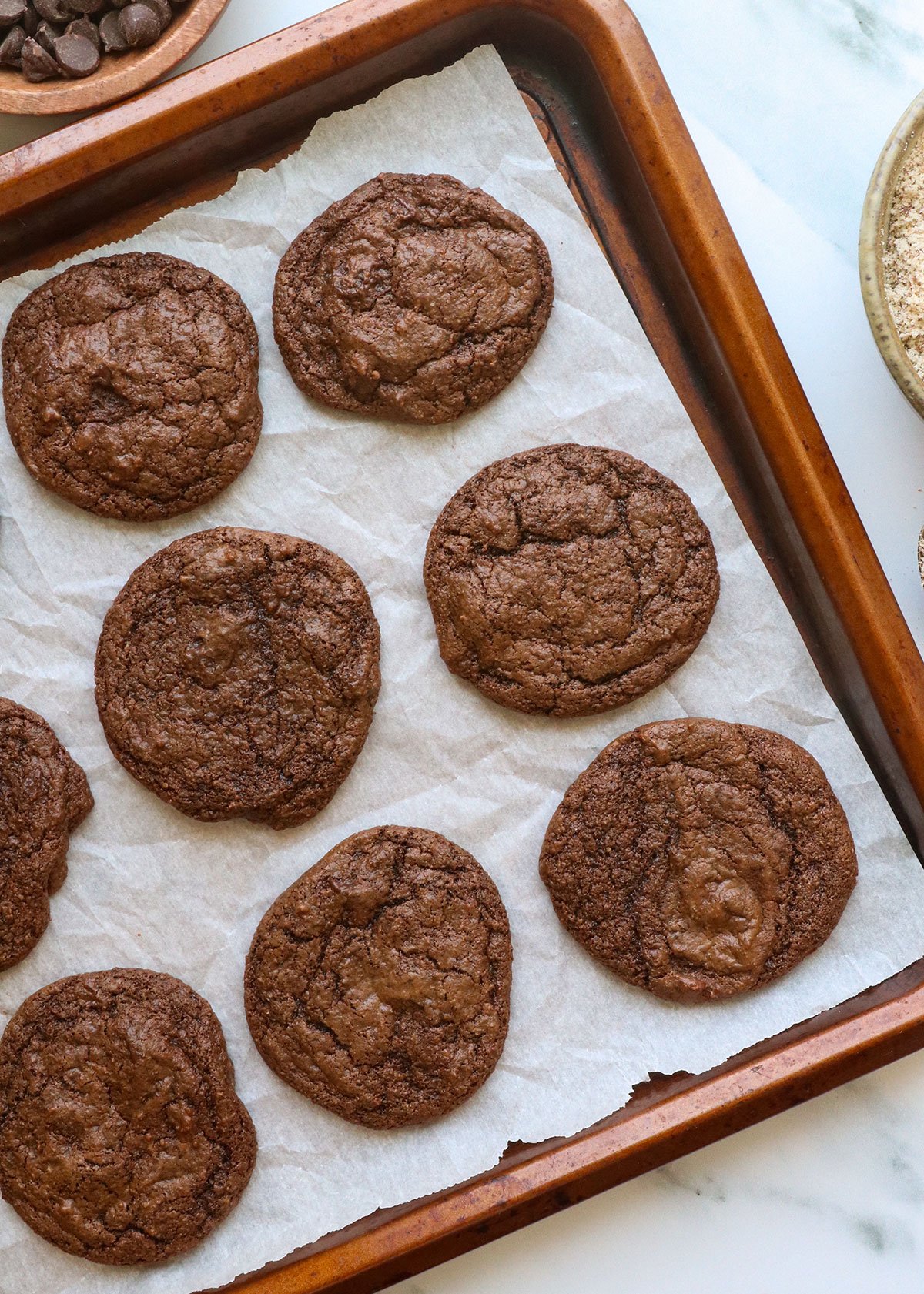 Almond cakes cool on the pan. 