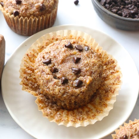 almond meal muffin on a plate unwrapped.