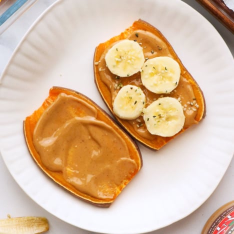sweet potato toast with toppings on a white plate.