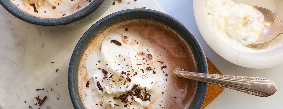 closeup of hot chocolate in a blue mug.