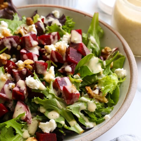 Shallot vinaigrette drizzled over a salad with beets and goat cheese.