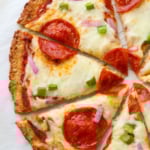 close up of cauliflower pizza crust recipe with toppings.
