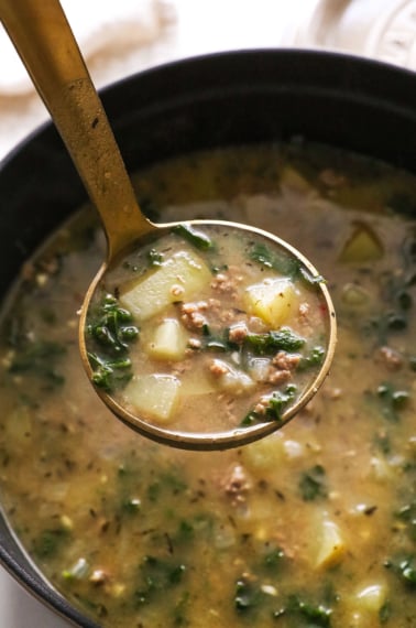 healthy zuppa toscana soup recipe on ladle.