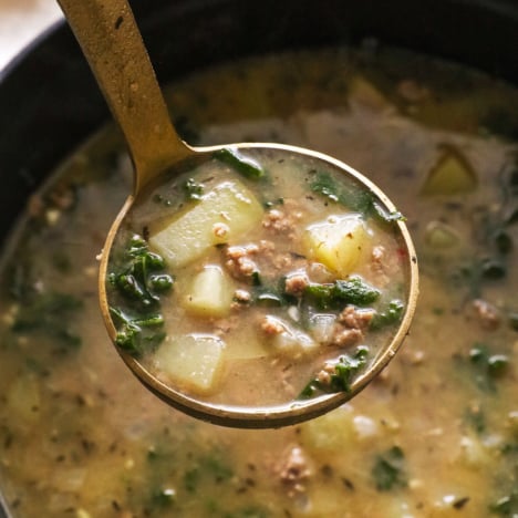 healthy zuppa toscana soup recipe on ladle.