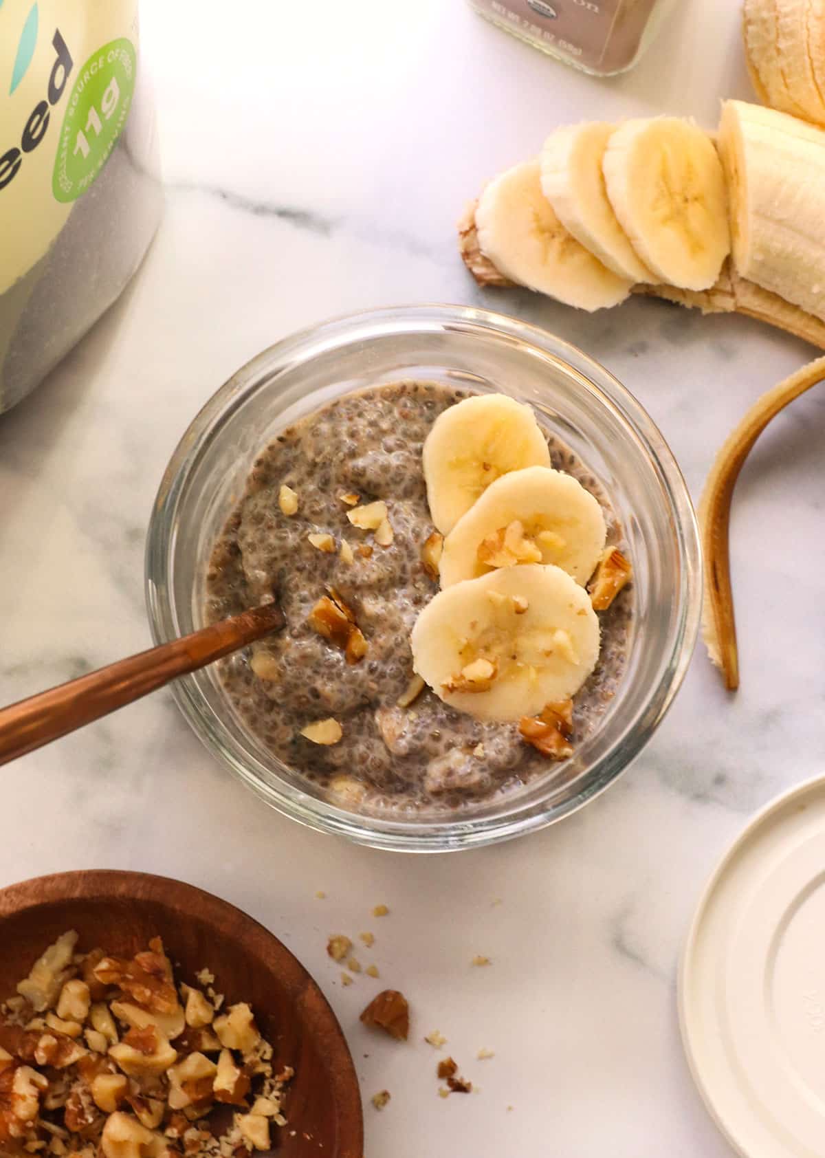 chia pudding topped with banana and walnuts.