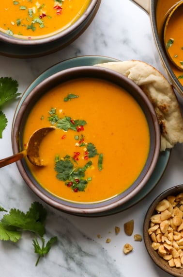 pumpkin curry soup in a bowl with cilantro.