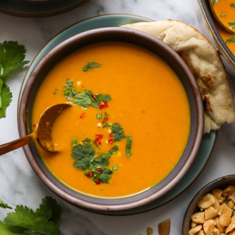 pumpkin curry soup in a bowl with cilantro.