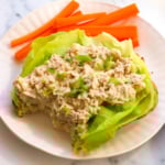 tuna salad without mayo served on butter lettuce with carrots on the side.
