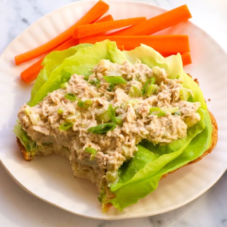 tuna salad without mayo served on butter lettuce with carrots on the side.
