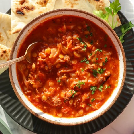stuffed cabbage soup served in a bowl with lentils.