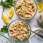 two jars of tuna and chickpea salad with lids.