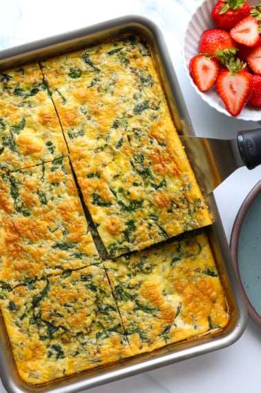 cottage cheese egg bake sliced into big squares in a baking dish.